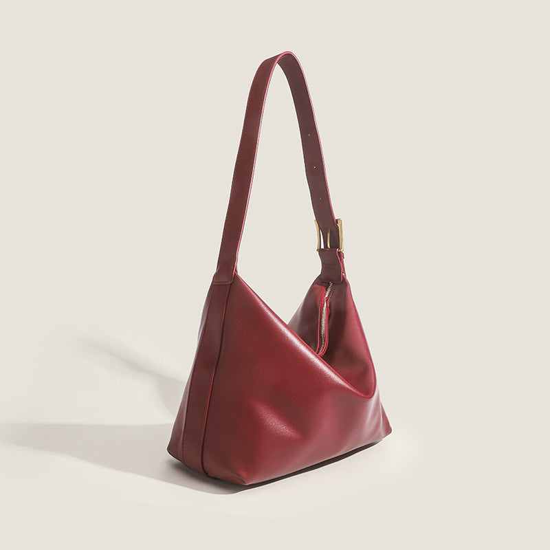 Large slouchy hobo shoulder bag in smooth leather-look finish with single long strap and gold-tone zip closure, detail view 3