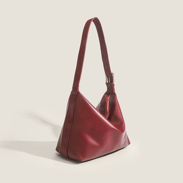 Large slouchy hobo shoulder bag in smooth leather-look finish with single long strap and gold-tone zip closure, detail view 3