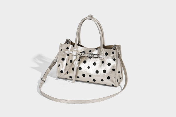 Structured glossy leather-look polka-dot satchel tote with dual top handles and detachable shoulder strap, detail view 9
