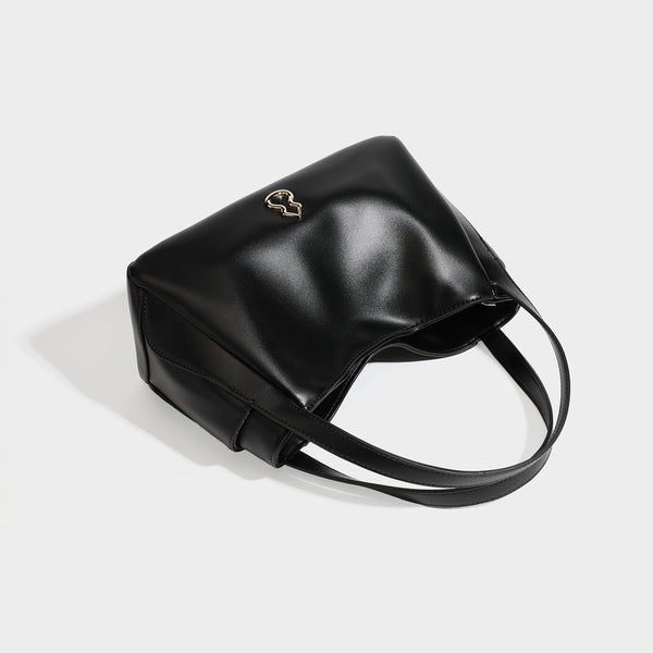 Structured glossy leather-look tote shoulder bag with dual top handles, detachable crossbody strap, side pockets, and, detail
