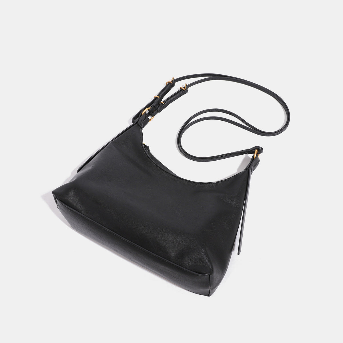 Slouchy hobo shoulder bag in smooth leather-look finish with gold-tone hardware and adjustable strap, detail view 4