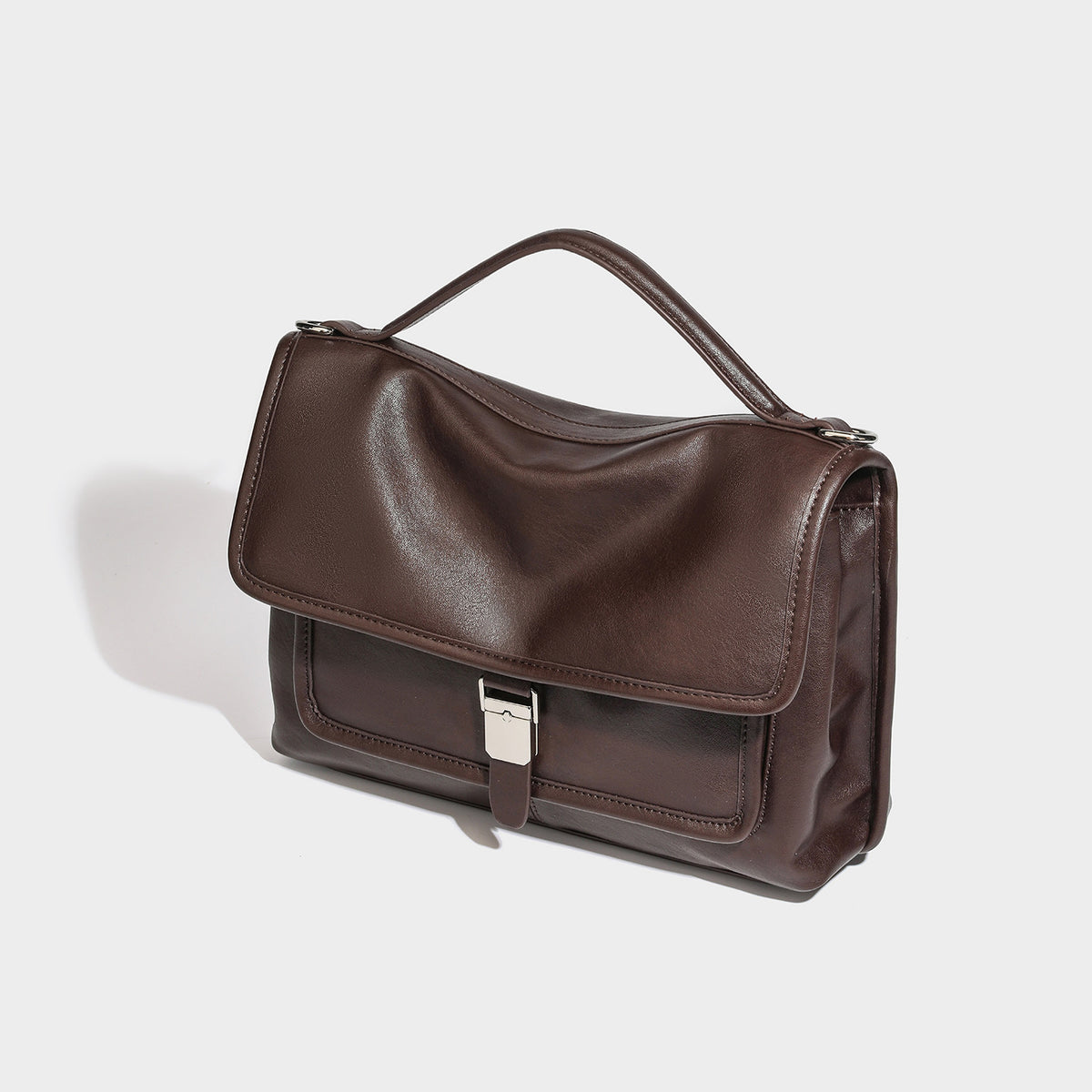 Structured rectangular satchel bag in dark espresso brown with smooth leather-look finish, flap front with silver turn-lock