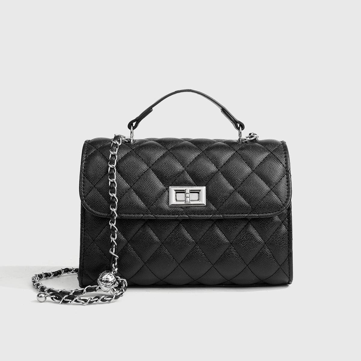 Small structured diamond-quilted flap satchel bag with silver-tone chain strap and turn-lock closure, front view