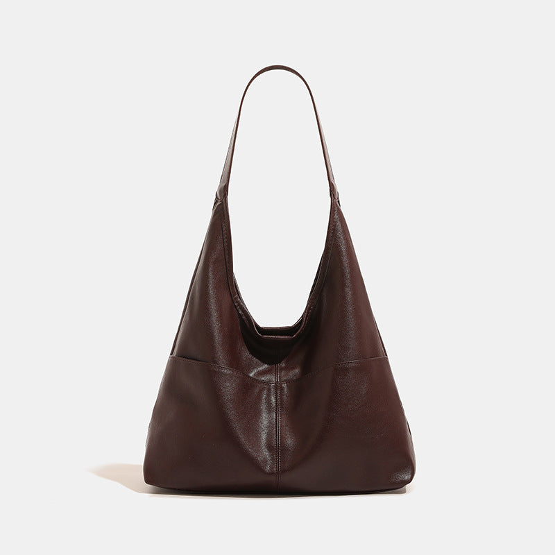 Oversized slouchy hobo tote bag in dark brown smooth matte leather-look finish with long flat shoulder strap and panelled