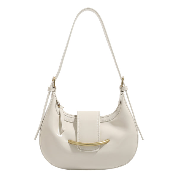 Compact crescent hobo shoulder bag with glossy synthetic finish, curved gold-tone front bar hardware, zip-top closure, and