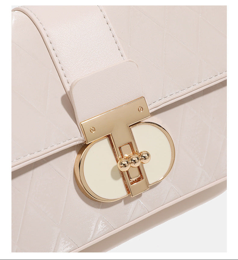 Compact rectangular quilted flap crossbody bag with gold-tone turn-lock closure and chain strap, detail view 17