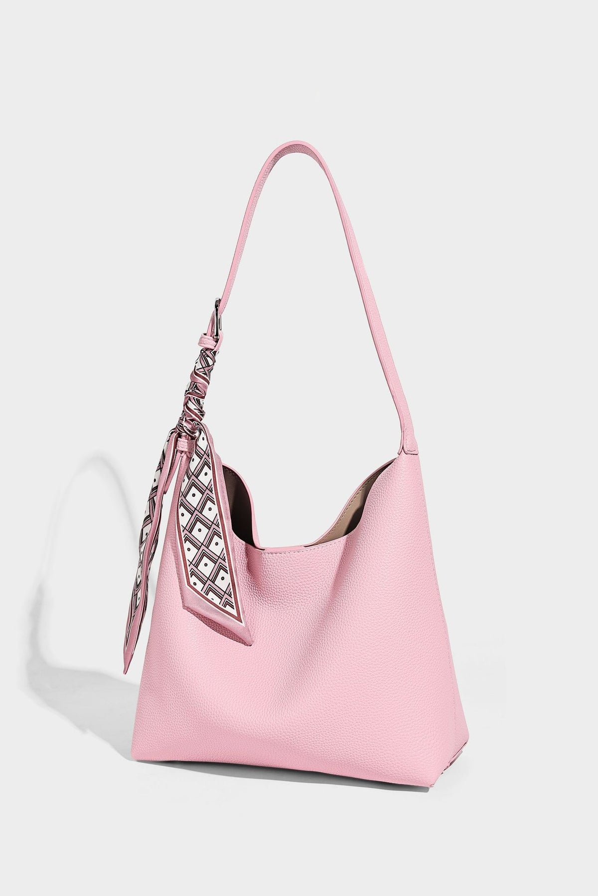 Soft slouchy hobo shoulder bag in pebbled matte finish with slim strap, silver-tone ring hardware, and knotted printed scarf