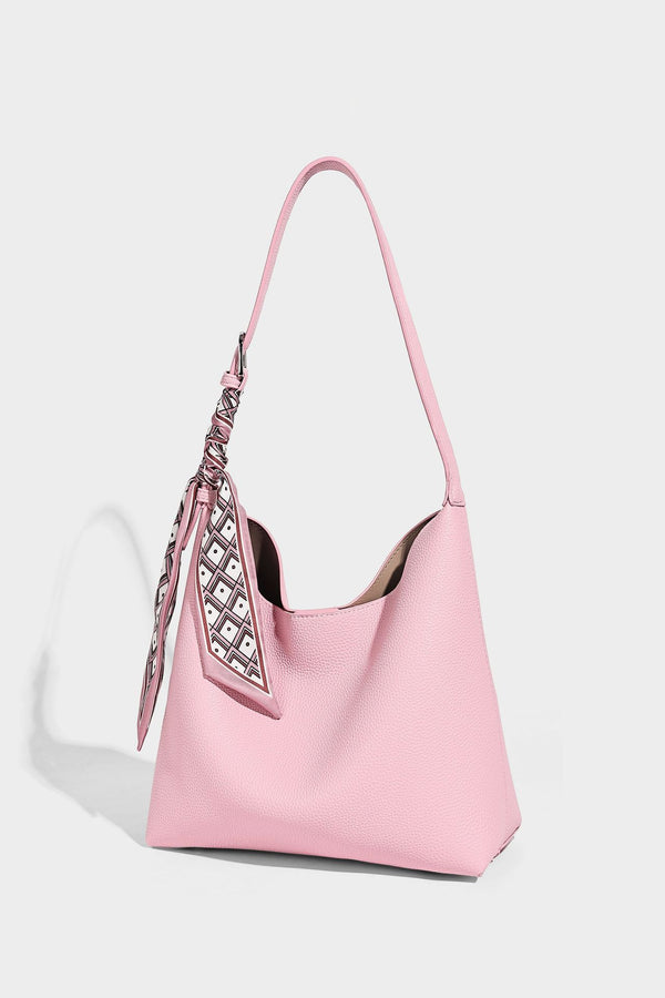 Soft slouchy hobo shoulder bag in pebbled matte finish with slim strap, silver-tone ring hardware, and knotted printed scarf