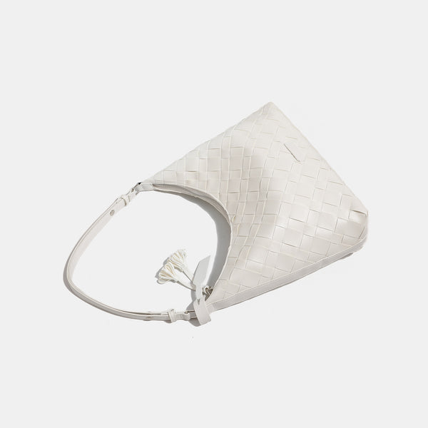 Large woven checker hobo shoulder bag with slim strap, silver-tone hardware, and braided tassel zipper pull, detail view 4