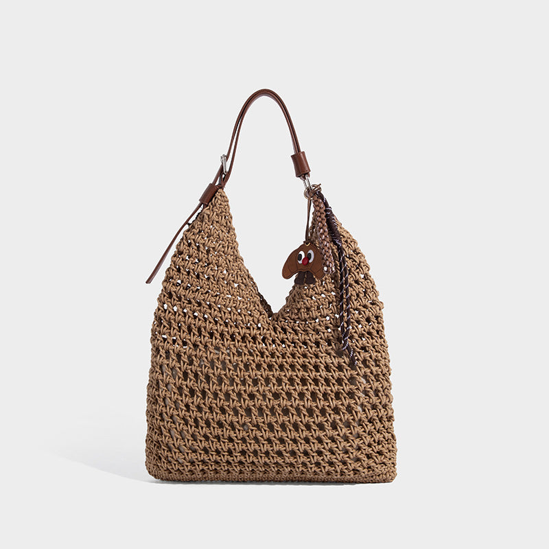 Slouchy open-knit crochet hobo tote bag with leather-look top handle and metal buckle hardware, detail view 3