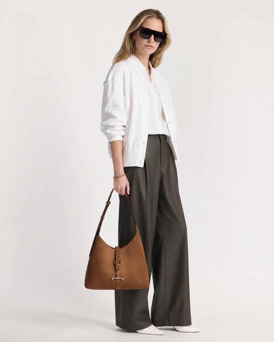Slouchy hobo shoulder bag with gold-tone toggle ring hardware and adjustable strap, detail view 10