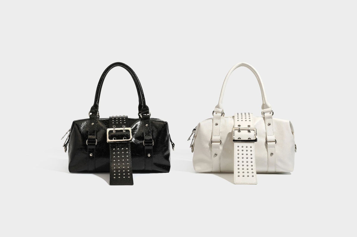 Glossy crinkled barrel handbag with silver stud buckle strap and detachable shoulder strap, detail view 42