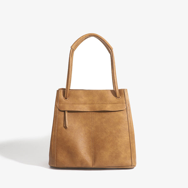 Retro structured matte leather-look tote bag in camel with front flap pocket, tassel pull, and double top handles, detail