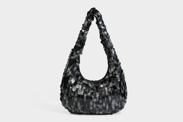 Slouchy crescent hobo shoulder bag covered in overlapping reflective sequin discs with a single integrated strap and top-zip