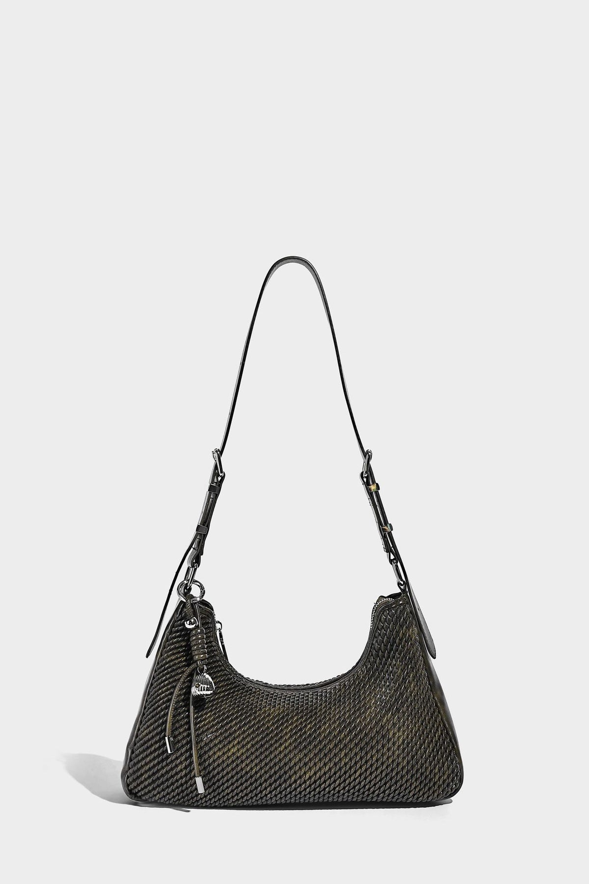 Woven crescent hobo shoulder bag with smooth side panels, zip-top closure, silver-tone charm hardware, and adjustable, detail