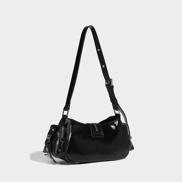 Compact glossy leather-look crossbody bag with silver studs, buckle hardware, and multiple zip pockets, detail view 19