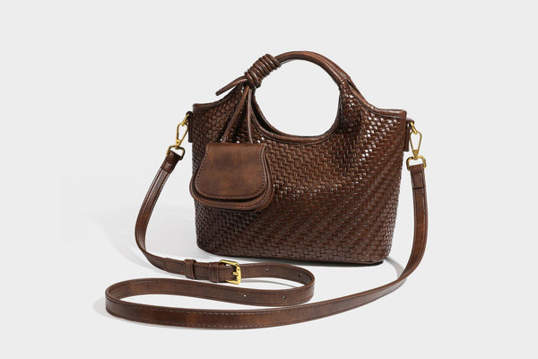 Woven leather-look tote bag in mocha brown with knotted top handle, front flap pocket, and detachable crossbody strap with