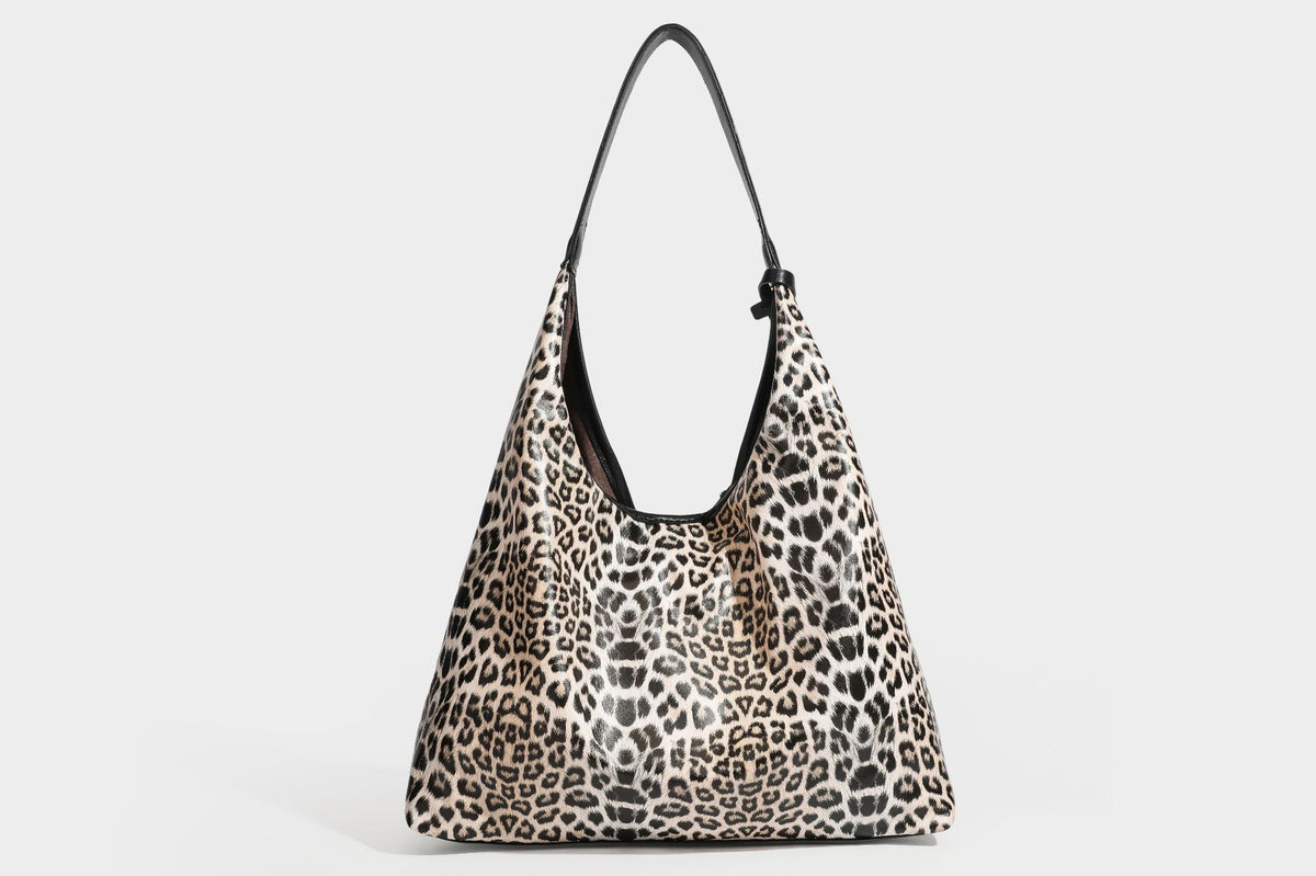 Glossy leopard-print slouchy shoulder bag with long strap and detachable tan zip pouch, detail view 39