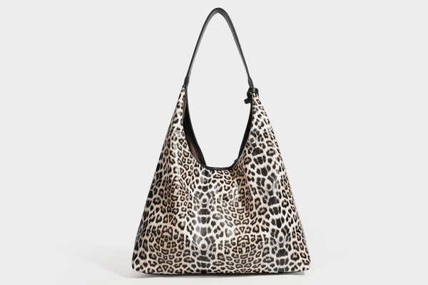 Glossy leopard-print slouchy shoulder bag with long strap and detachable tan zip pouch, detail view 39