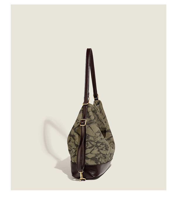 Large ink-wash printed corduroy hobo bag with dark brown leather-look base trim, diagonal front zip pocket, and gold-tone