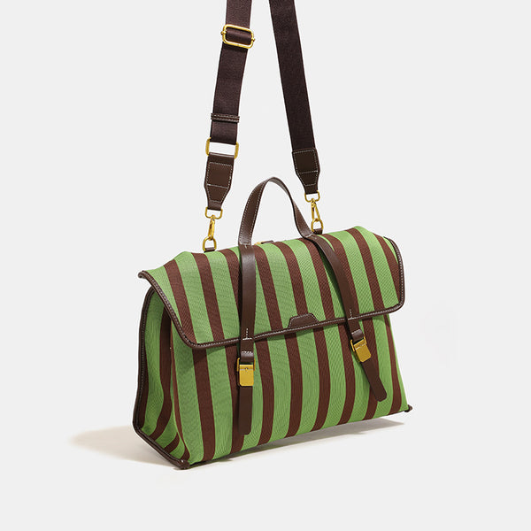 Structured striped canvas convertible satchel bag with leather-look trim, gold-tone buckle hardware, and backpack straps