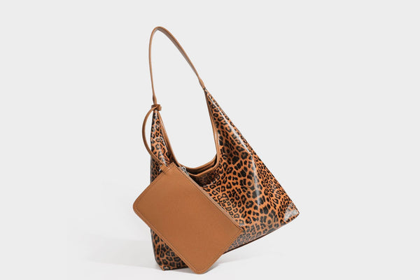 Glossy leopard-print slouchy shoulder bag with long strap and detachable tan zip pouch, detail view 22
