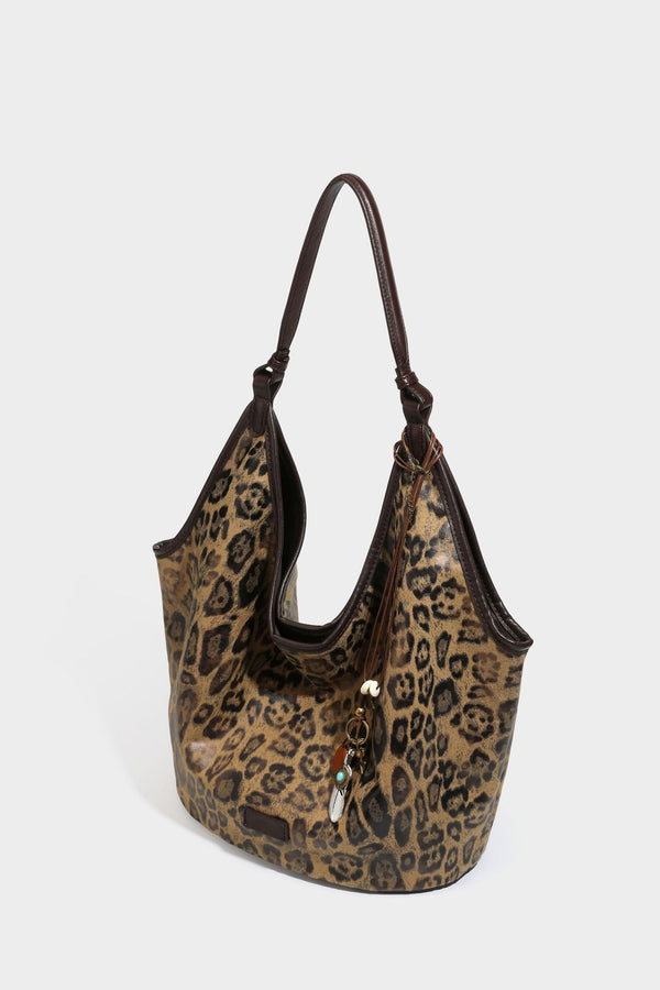 Large slouchy leopard-print shoulder tote bag with glossy tan-and-brown finish, dark brown leather-look trim, single