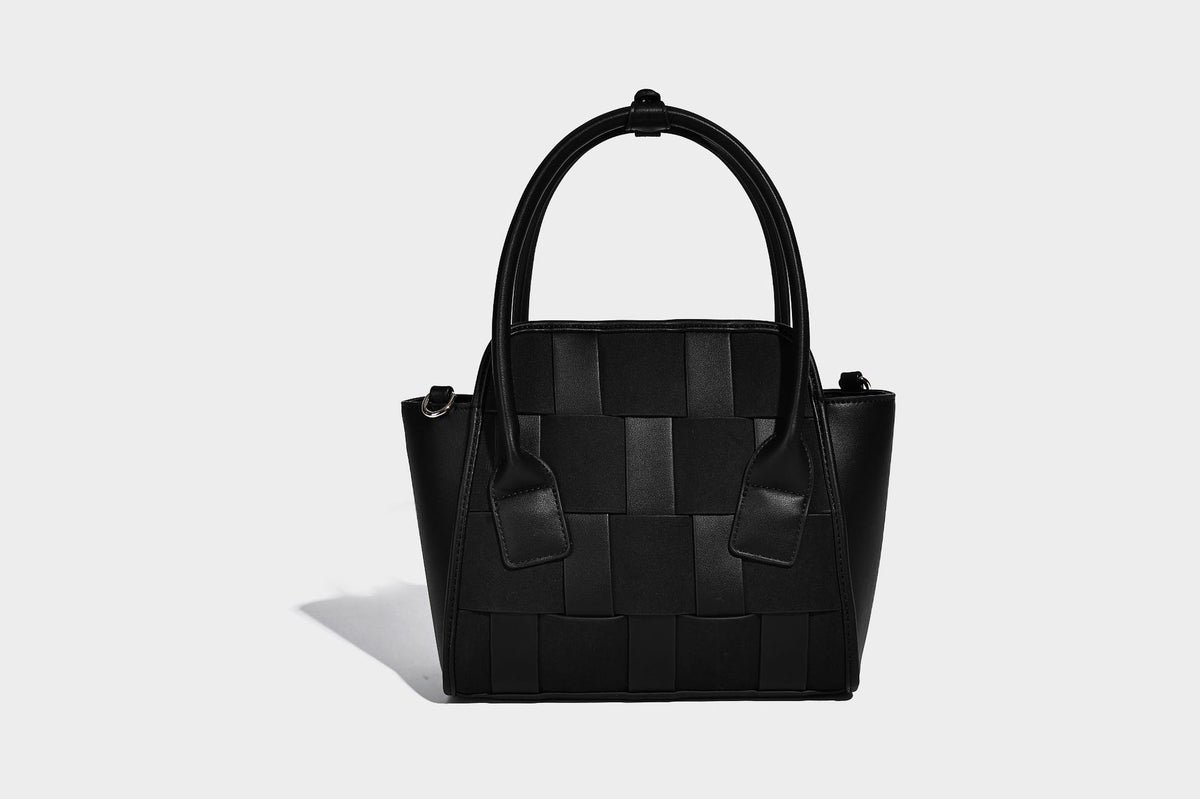 Small structured woven-panel mini tote bag with double top handles and detachable crossbody strap in matte leather-look
