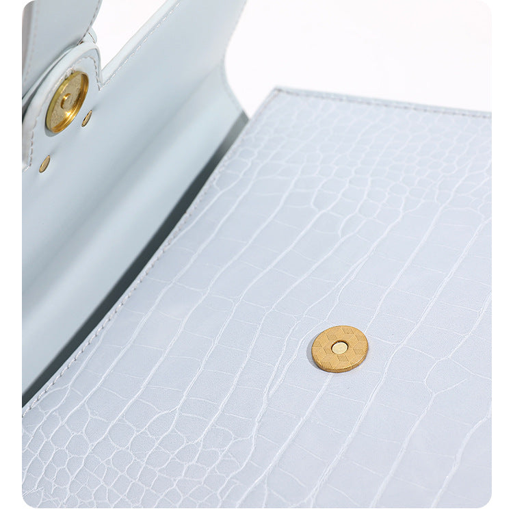 Structured crocodile-embossed flap shoulder bag with gold chain buckle hardware and adjustable strap, detail view 17