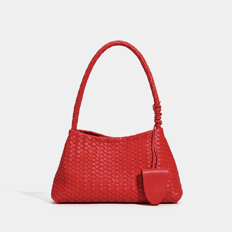 Woven leather-look shoulder bag with braided strap, trapezoidal body, and matching zip pouch, front view