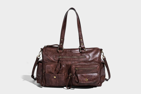Distressed leather-look vintage satchel shoulder bag with multiple front zip pockets, dual top handles, and brass-tone