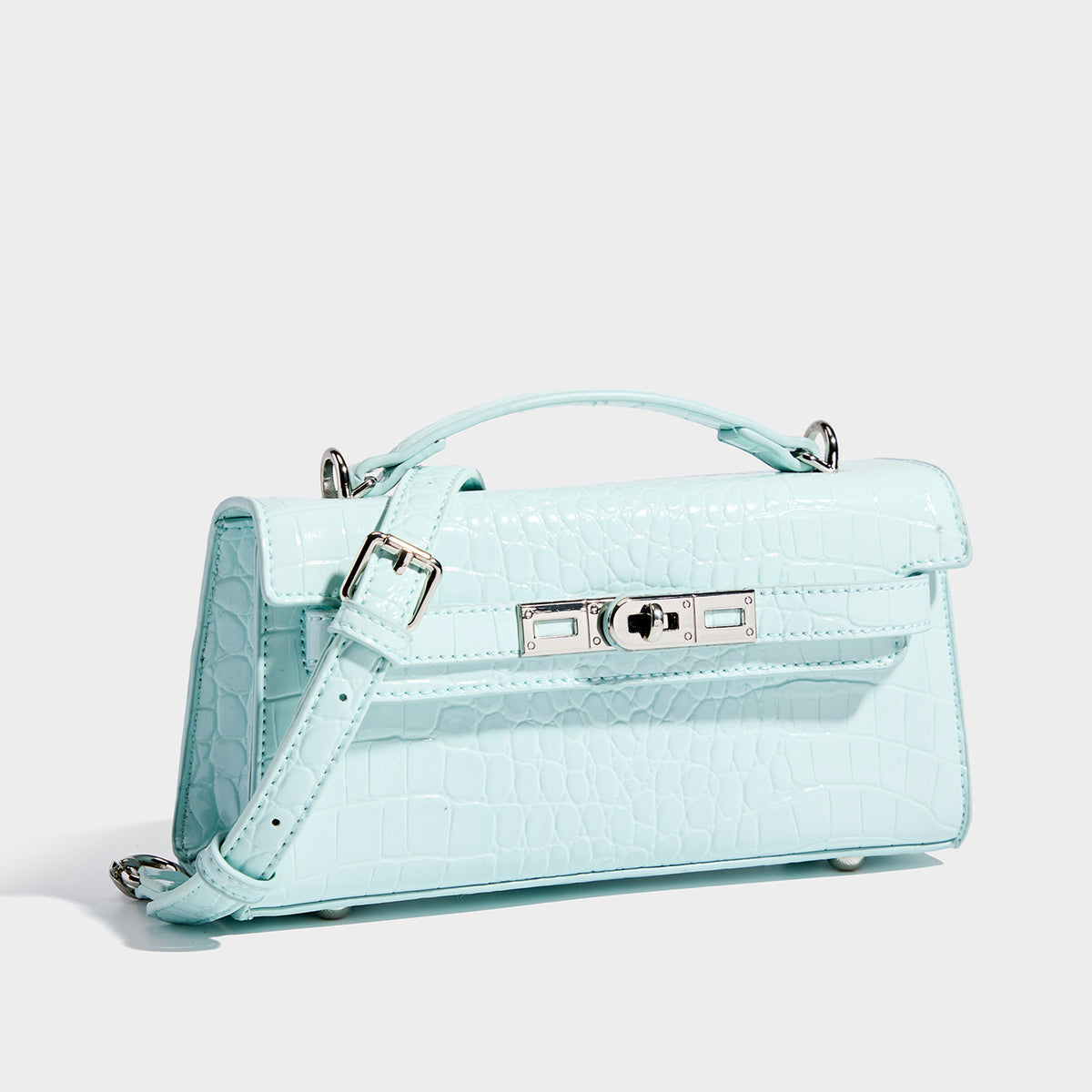 Compact structured flap satchel with glossy crocodile-embossed leather-look finish, silver-tone turn-lock hardware, and