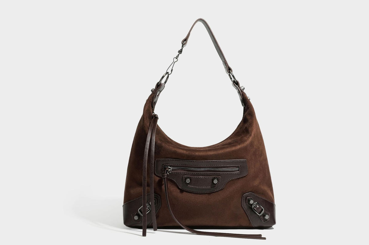 Slouchy suede-finish hobo shoulder bag with dark hardware, exterior zip pocket, tassel ties, and detachable crossbody strap