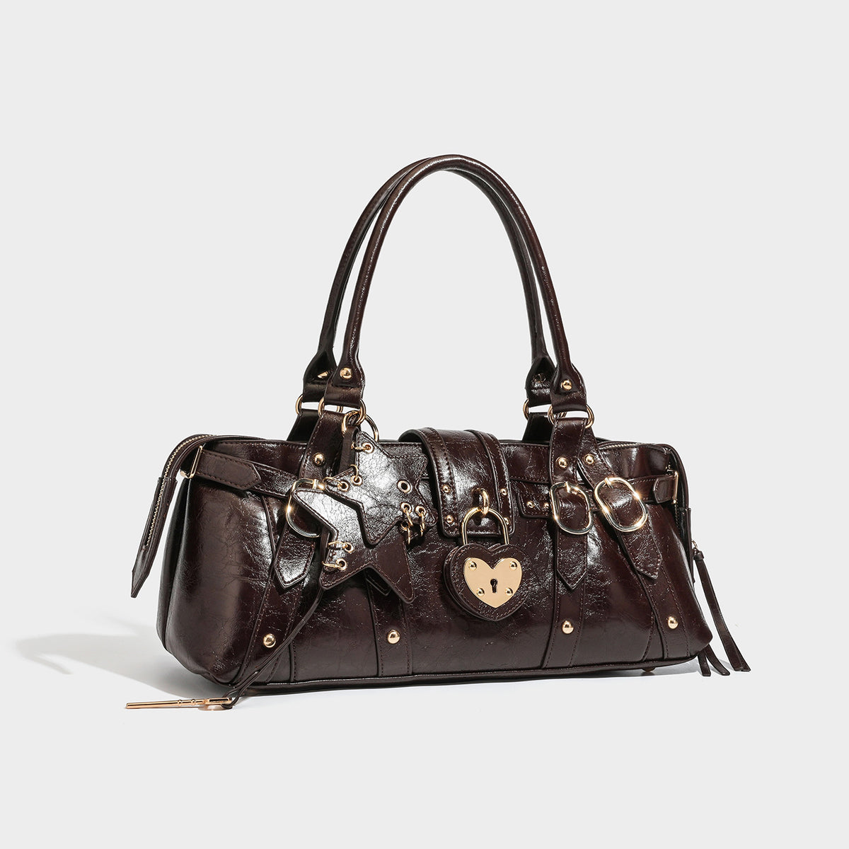 Dark brown glossy crinkled leather-look barrel bag with gold heart lock, dome studs, star charm, dual top handles and, detail
