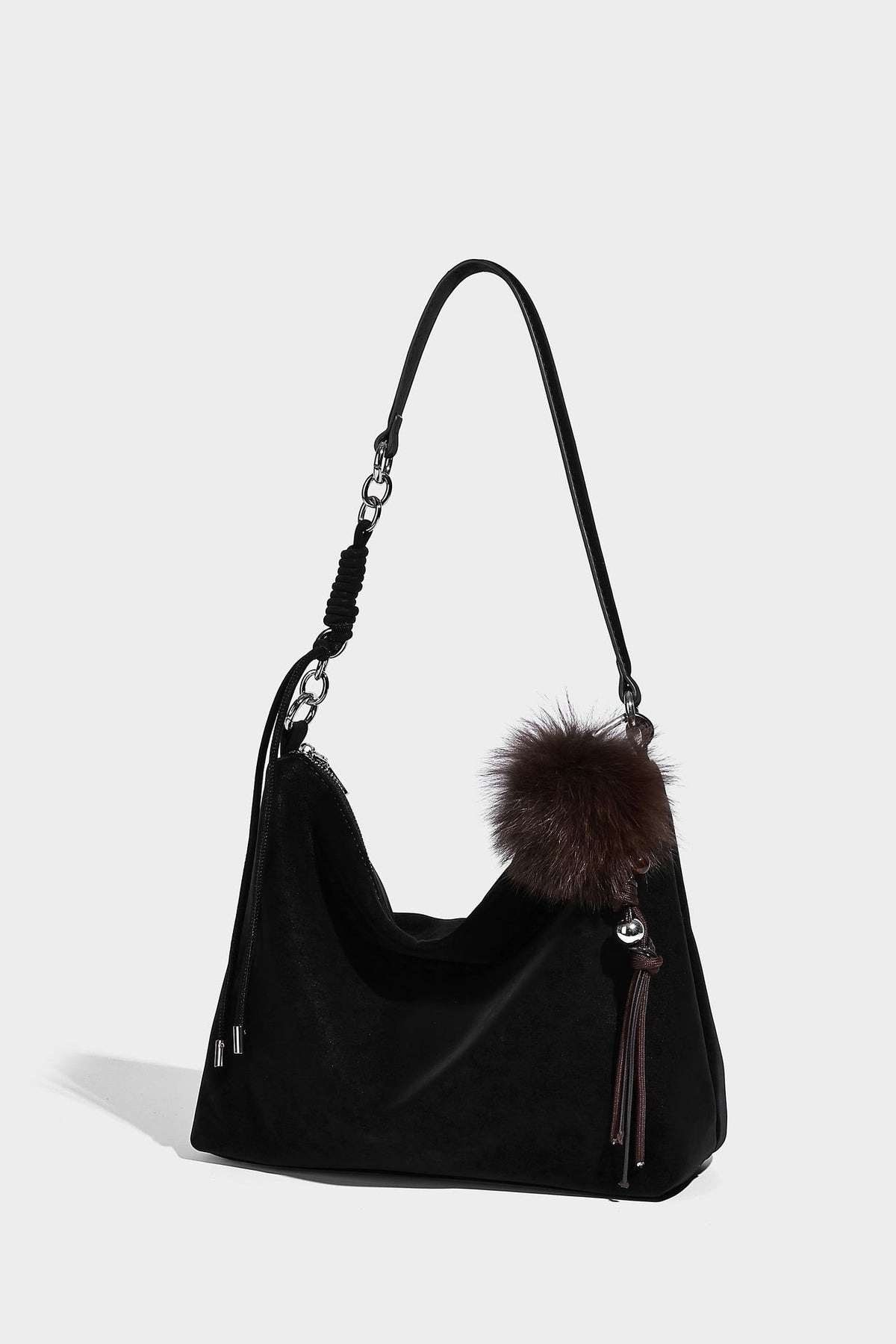 Slouchy matte-finish hobo shoulder bag with tassel cords, silver-tone hardware, and faux-fur pom charm, detail view 32