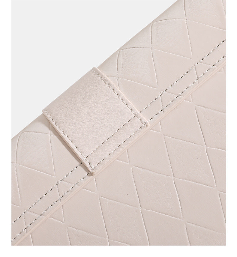 Compact quilted flap crossbody bag with gold turn-lock clasp and adjustable shoulder strap, detail view 10