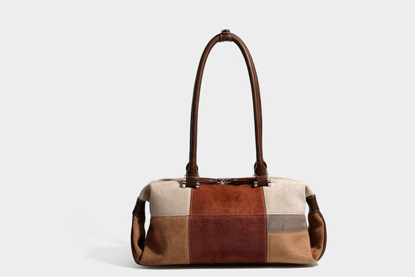 Patchwork suede-look barrel shoulder bag in brown, rust, tan, beige, and gray panels with double leather-look straps and