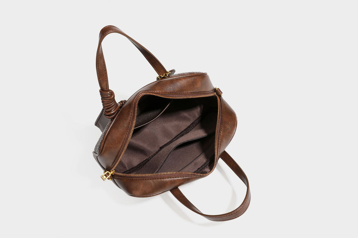 Strukturierte rechteckige Satchel-Tasche mit gewebtem Vorderteil in Lederoptik, goldfarbenen Details, zwei Tragegriffen und abnehmbarem