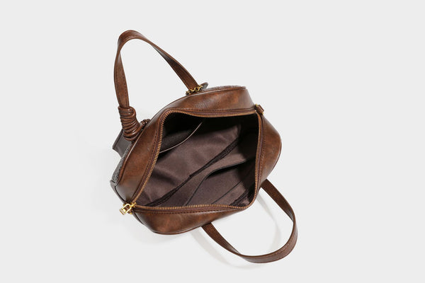 Strukturierte rechteckige Satchel-Tasche mit gewebtem Vorderteil in Lederoptik, goldfarbenen Details, zwei Tragegriffen und abnehmbarem