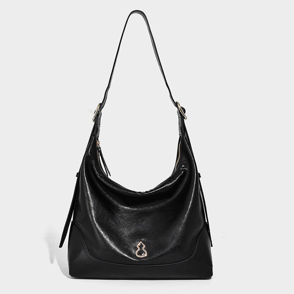 Glossy leather-look slouchy hobo shoulder bag with zip closure, gold-tone hardware, and adjustable strap, detail view 3