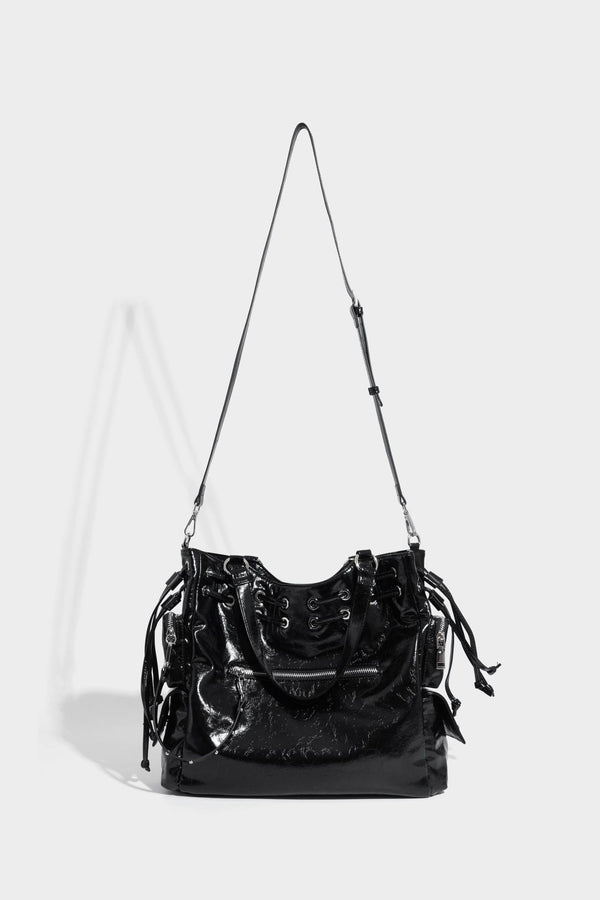 Glossy crinkled leather-look tote bag with silver grommet lace-up front detail, dual top handles, and detachable shoulder