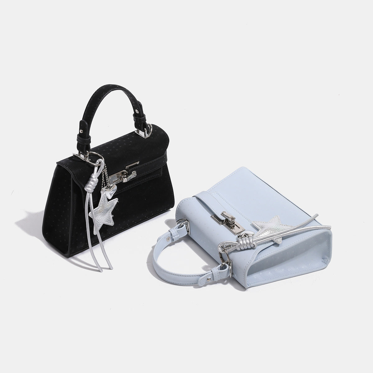 Mini structured trapezoid satchel with embossed textured finish, silver-tone turn-lock closure, star charm with cord tassels