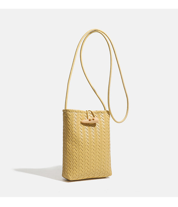 Compact woven leather-look bucket crossbody pouch with toggle closure and long fixed strap, detail view 13