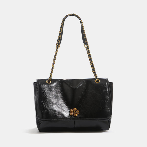 Structured glossy flap shoulder bag with antique gold floral turn-lock clasp and chain-and-leather strap, detail view 6