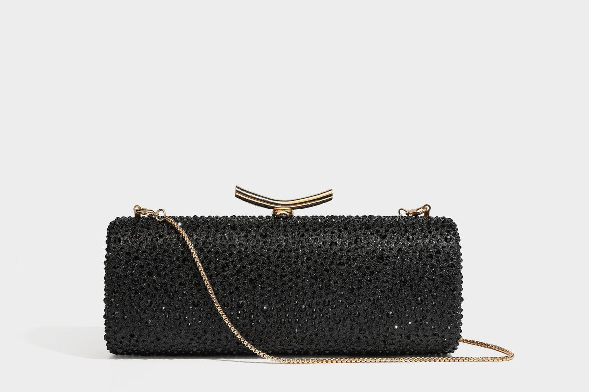 Structured rectangular hard-case clutch bag covered in all-over rhinestone crystal embellishment with curved kiss-lock top