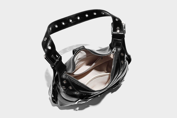 Glossy crescent hobo bag with silver-tone grommets, square buckle straps, and top zipper closure, detail view 27