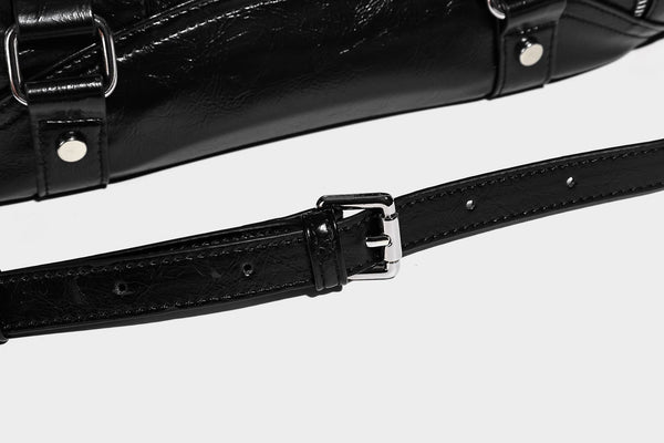 Glossy structured black tote shoulder bag with silver buckle hardware, zip pockets, dual top handles, and detachable, detail