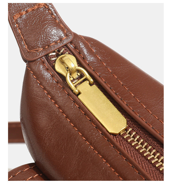 Compact glossy oil-wax leather-look shoulder bag with front buckle flap pocket and gold-tone hardware, detail view 15