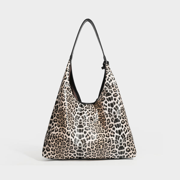 Glossy leopard-print slouchy shoulder bag with long strap and detachable tan zip pouch, detail view 6