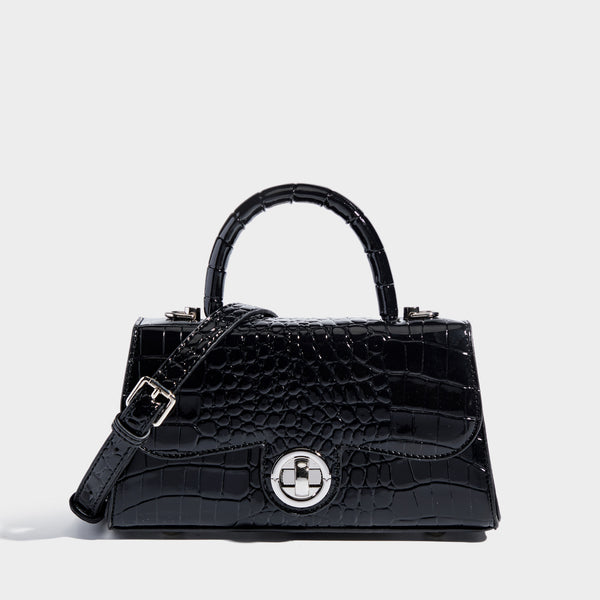 Mini croc-embossed glossy structured handbag with silver-tone turn-lock clasp and short top handle, detail view 8